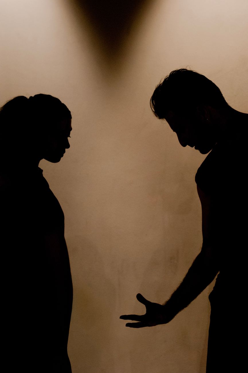 dramatic silhouette of couple in argument
